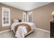 Cozy bedroom with plush carpet and two bright windows at 22198 Boundstone Dr, Parker, CO 80138