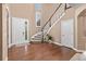 Grand foyer with hardwood floors, a winding staircase, and ample natural light at 22198 Boundstone Dr, Parker, CO 80138