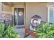 Welcoming front porch with rocking chair and decorative wreath on the door, creating a warm, inviting entrance at 22198 Boundstone Dr, Parker, CO 80138