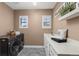 Functional laundry room with modern appliances, counter space, and ample storage at 22198 Boundstone Dr, Parker, CO 80138