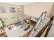 Bright, open-concept living space features soaring ceilings, large windows, and a comfortable seating area at 22198 Boundstone Dr, Parker, CO 80138