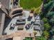 Aerial view of a stylish patio with stone steps, comfortable seating, a water feature, and well-maintained landscaping at 22198 Boundstone Dr, Parker, CO 80138