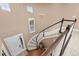 Elegant staircase with dark wood railing and white risers leads to the upper level at 22198 Boundstone Dr, Parker, CO 80138