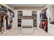 Spacious walk-in closet with custom shelving and ample storage space at 22198 Boundstone Dr, Parker, CO 80138