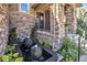 Intricate water feature with stone spheres, adding a touch of elegance and serenity to the front yard landscape at 22198 Boundstone Dr, Parker, CO 80138