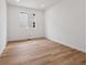 Bright bedroom with luxury vinyl floors, recessed lighting, a double window, and fresh white walls at 45946 Gentry Ave, Bennett, CO 80102
