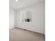 Bright bedroom with neutral carpet, a double window, and fresh white walls at 45946 Gentry Ave, Bennett, CO 80102