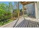 Backyard with wood deck, landscaping, a green kayak, and fencing at 17336 E Rice Cir # F, Aurora, CO 80015