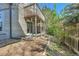 Backyard view of the home's deck with sliding glass doors and rock landscaping at 17336 E Rice Cir # F, Aurora, CO 80015