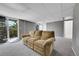 Finished basement with neutral carpet and a tan reclining sofa at 17336 E Rice Cir # F, Aurora, CO 80015
