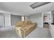 Finished basement with neutral carpet and a comfortable tan reclining sofa at 17336 E Rice Cir # F, Aurora, CO 80015