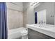 Clean bathroom with modern sink, large mirror, and tiled shower/tub combo at 17336 E Rice Cir # F, Aurora, CO 80015