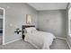 Bedroom with neutral walls, carpet flooring, and stylish decor at 17336 E Rice Cir # F, Aurora, CO 80015