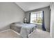 Cozy bedroom featuring a window for natural light and neutral tones at 17336 E Rice Cir # F, Aurora, CO 80015