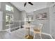 Charming dining area showcasing modern flooring, a stylish table, and ample natural light from nearby windows at 17336 E Rice Cir # F, Aurora, CO 80015