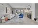 Living room showcasing a cozy fireplace, large windows, and modern flooring with a neutral color palette at 17336 E Rice Cir # F, Aurora, CO 80015