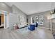 Stylish living room boasting a vaulted ceiling, hardwood floors, and big window at 17336 E Rice Cir # F, Aurora, CO 80015