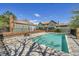 Community pool with lounge area and surrounding foliage at 17336 E Rice Cir # F, Aurora, CO 80015