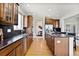 Updated kitchen features stainless steel appliances, granite countertops, and a central island at 16283 Olive Way, Brighton, CO 80602