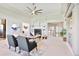 Spacious living room with large windows, neutral color palette, fireplace and recessed lighting at 16283 Olive Way, Brighton, CO 80602