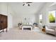 Bright bedroom featuring vaulted ceilings, carpet floors, and modern decor at 16283 Olive Way, Brighton, CO 80602