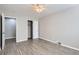 Well-lit bedroom with a ceiling fan, closet, and hardwood floors at 384 S Decatur St, Denver, CO 80219