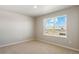 Neutral bedroom with carpet and lots of light at 48220 Shetland Dr, Bennett, CO 80102
