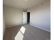 Bedroom featuring neutral carpeting and walls, illuminated by recessed lighting at 48220 Shetland Dr, Bennett, CO 80102