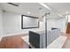 Finished basement with theater screen, hardwood floors, recessed lighting, and comfortable seating at 15034 E Floyd Ave, Aurora, CO 80014