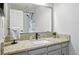Neutral toned bathroom featuring granite countertops, undermount sink and modern fixtures at 15034 E Floyd Ave, Aurora, CO 80014