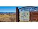 Park signage with map and trail information against a natural backdrop for outdoor enthusiasts at 15034 E Floyd Ave, Aurora, CO 80014