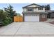Two-story home with a large driveway and attached garage at 15034 E Floyd Ave, Aurora, CO 80014