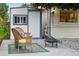 Backyard shed with patio area, fire pit, wicker chairs and rock landscaping at 15034 E Floyd Ave, Aurora, CO 80014