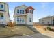 Stylish two-story house with covered porch, modern color scheme, and low maintenance yard at 5928 N Lisbon St, Aurora, CO 80019