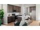 Kitchen featuring wood cabinets, stainless steel appliances, and a large island with barstool seating at 5928 N Lisbon St, Aurora, CO 80019