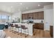 Kitchen with an island featuring bar seating, stainless appliances, and plenty of cabinet space at 5928 N Lisbon St, Aurora, CO 80019