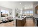 Open-concept living room with a modern island and an abundance of natural light at 5928 N Lisbon St, Aurora, CO 80019