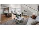 Comfortable living room and dining room with hardwood floors and an open floor plan at 5928 N Lisbon St, Aurora, CO 80019