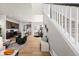 Light-filled open-concept layout with staircase, living room, dining area, and modern kitchen at 5928 N Lisbon St, Aurora, CO 80019