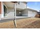 Covered patio with a view of the landscaped backyard; perfect for outdoor living at 5928 N Lisbon St, Aurora, CO 80019