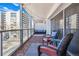 Condo balcony featuring outdoor seating, lighting, and neighborhood views at 888 N Logan St # 5A, Denver, CO 80203