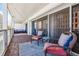 Charming outdoor balcony featuring brick flooring, a stylish rug, and comfortable seating, perfect for relaxation and enjoying city views at 888 N Logan St # 5A, Denver, CO 80203