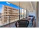 Balcony with outdoor seating area overlooking the city buildings at 888 N Logan St # 5A, Denver, CO 80203