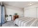 Bright bedroom with white walls, sliding door closet, and large window at 888 N Logan St # 5A, Denver, CO 80203