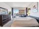 Spacious bedroom featuring a large window, a comfy bed, and city views at 888 N Logan St # 5A, Denver, CO 80203