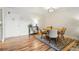 Cozy dining room featuring a round table, modern chairs, and stylish rug on hardwood floors at 888 N Logan St # 5A, Denver, CO 80203
