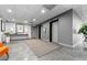 Hallway with neutral-colored floors and walls, decorated with plants, near elevators at 888 N Logan St # 5A, Denver, CO 80203