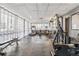 Well-equipped gym featuring modern exercise machines, weights, and a large window, creating an ideal space for fitness at 888 N Logan St # 5A, Denver, CO 80203