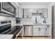 Modern kitchen features stainless steel appliances, sleek cabinetry, and white subway tile backsplash at 888 N Logan St # 5A, Denver, CO 80203