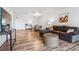 Open-concept living room with wood floors, a dining area, and stylish furniture creating a welcoming space at 888 N Logan St # 5A, Denver, CO 80203